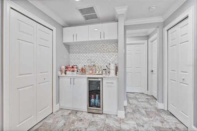 1450 Belfiore Way, Windermere, FL 34786 - indoor bar with wine cooler, crown molding, and tasteful backsplash