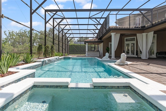 1450 Belfiore Way, Windermere, FL 34786 - view of pool with french doors, a pool with connected hot tub, a patio, and glass enclosure