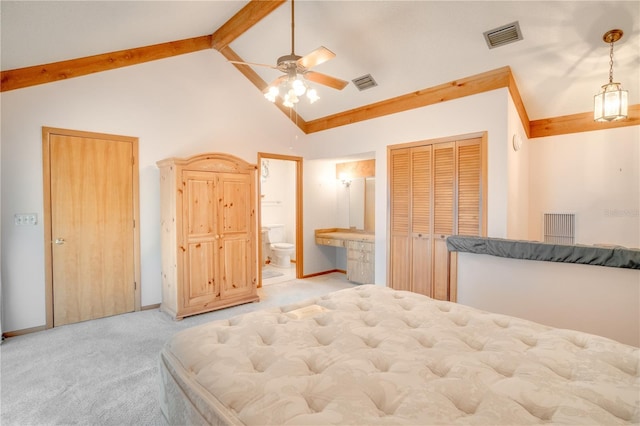 bedroom featuring ensuite bathroom, carpet flooring, and visible vents