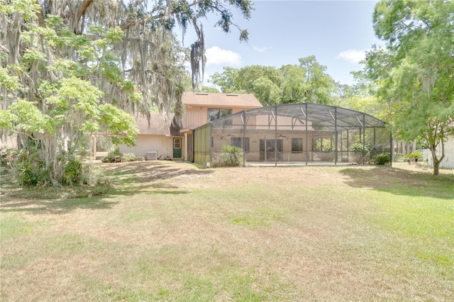 view of yard with a lanai