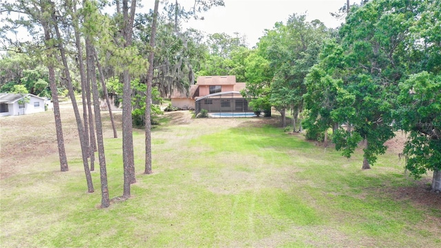 view of yard with an outdoor pool