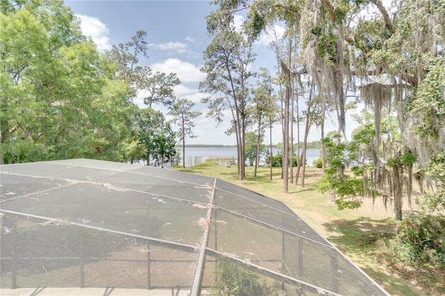 view of sport court featuring a water view