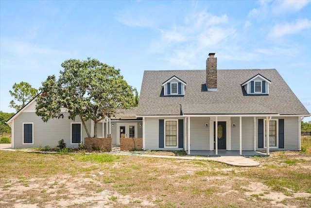 6803 Round Lake Rd, Mount Dora, FL 32757 - view of front facade with french doors, a chimney, a porch, and a shingled roof