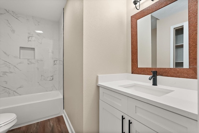 6803 Round Lake Rd, Mount Dora, FL 32757 - bathroom featuring toilet, vanity, wood finished floors, baseboards, and bathing tub / shower combination