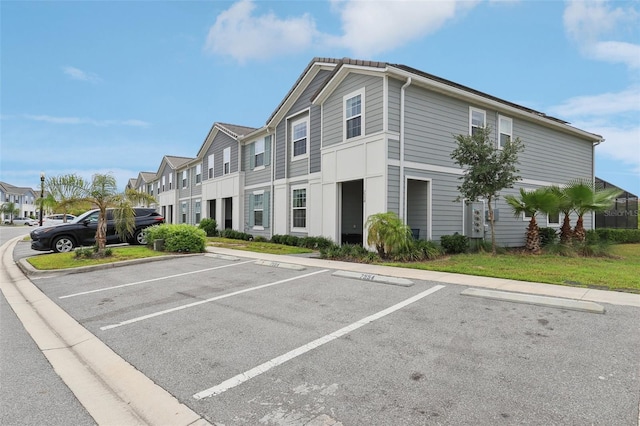 7554 Oak Spring Ln, Davenport, FL 33837 - view of property with uncovered parking and a residential view