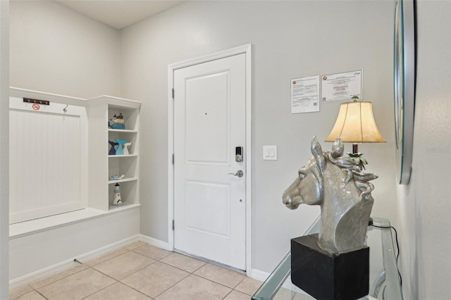 7554 Oak Spring Ln, Davenport, FL 33837 - entrance foyer featuring light tile patterned floors and baseboards