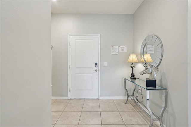 7554 Oak Spring Ln, Davenport, FL 33837 - foyer featuring light tile patterned flooring and baseboards