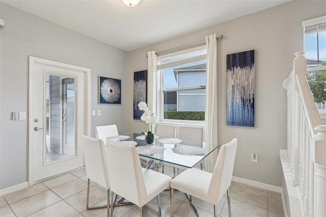 7554 Oak Spring Ln, Davenport, FL 33837 - dining space featuring baseboards and light tile patterned flooring