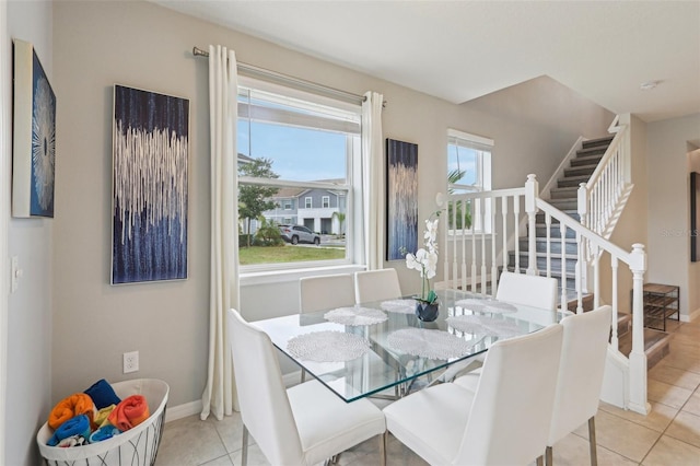 7554 Oak Spring Ln, Davenport, FL 33837 - tiled dining room with stairs and baseboards