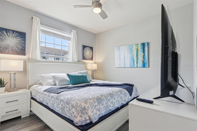 7554 Oak Spring Ln, Davenport, FL 33837 - bedroom featuring dark wood finished floors and a ceiling fan