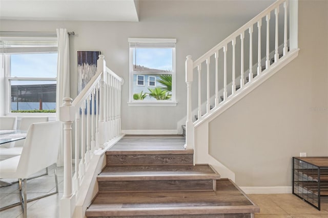 7554 Oak Spring Ln, Davenport, FL 33837 - stairs featuring baseboards