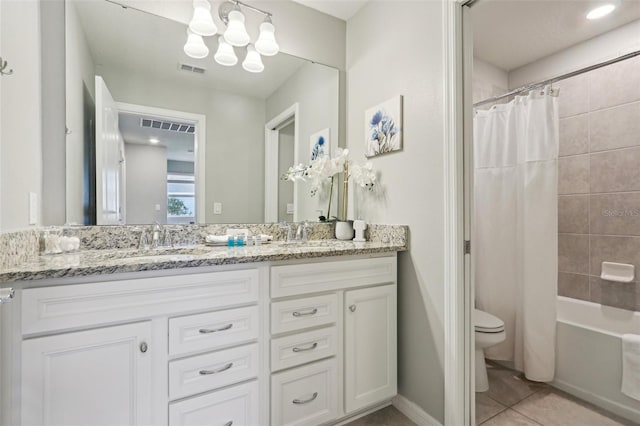 7554 Oak Spring Ln, Davenport, FL 33837 - bathroom featuring double vanity, toilet, tile patterned flooring, shower / bath combo, and a chandelier