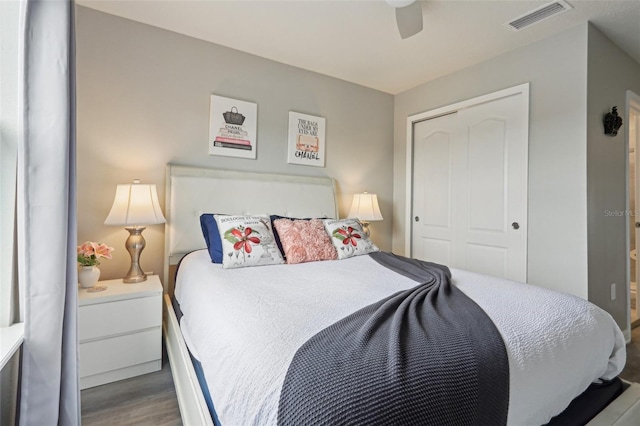 7554 Oak Spring Ln, Davenport, FL 33837 - bedroom featuring wood finished floors, a closet, and a ceiling fan