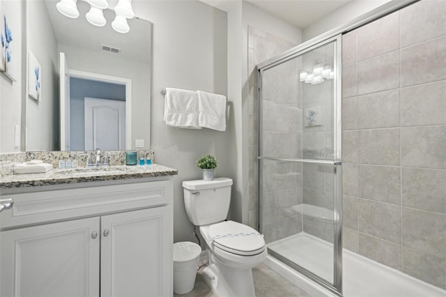 7554 Oak Spring Ln, Davenport, FL 33837 - bathroom with toilet, vanity, a shower stall, and a chandelier