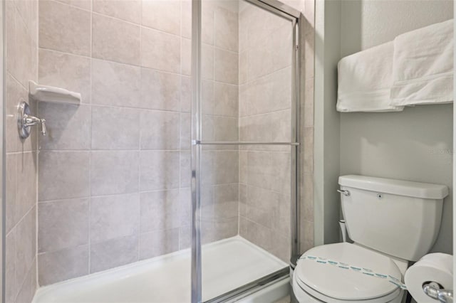 7554 Oak Spring Ln, Davenport, FL 33837 - bathroom with a shower stall and toilet