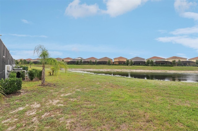 7554 Oak Spring Ln, Davenport, FL 33837 - view of grassy yard with a water view and a residential view