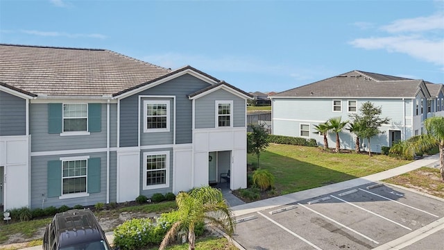 7554 Oak Spring Ln, Davenport, FL 33837 - back of property with uncovered parking and a yard