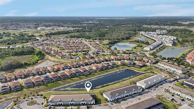 7554 Oak Spring Ln, Davenport, FL 33837 - aerial overview of property's location with nearby suburban area and a nearby body of water