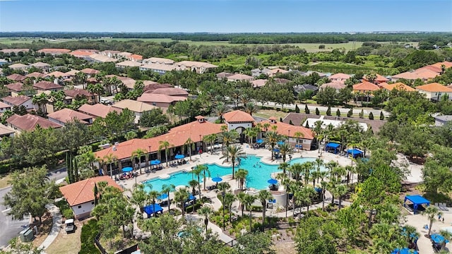 7554 Oak Spring Ln, Davenport, FL 33837 - aerial overview of property's location with a pool and nearby suburban area