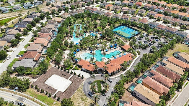 7554 Oak Spring Ln, Davenport, FL 33837 - aerial view of property and surrounding area featuring a pool and nearby suburban area