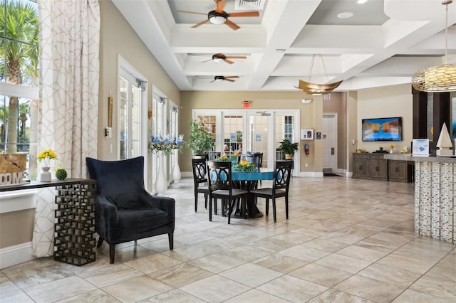 7554 Oak Spring Ln, Davenport, FL 33837 - dining room with ceiling fan, coffered ceiling, baseboards, and beam ceiling