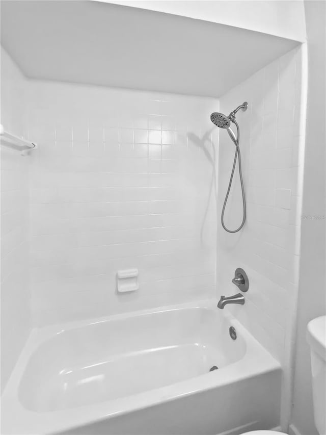 full bath with toilet and shower / washtub combination