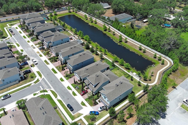 bird's eye view with a water view and a residential view