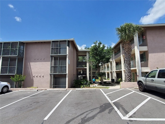 view of property with uncovered parking