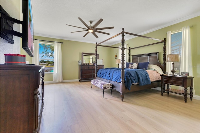 bedroom with baseboards, ornamental molding, and light wood-type flooring