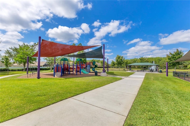 communal playground with a lawn and a gazebo