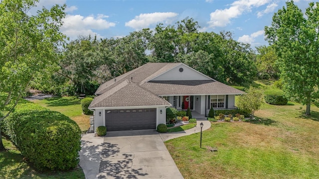 view of front of house with covered porch, an attached garage, concrete driveway, and a front lawn