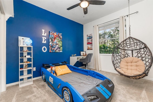 bedroom with baseboards, ceiling fan, and carpet flooring