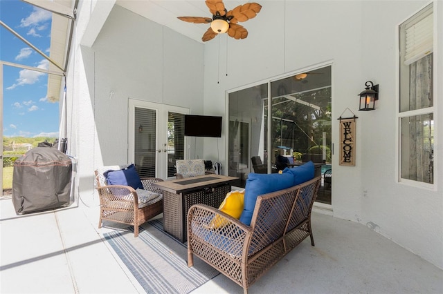 view of patio featuring ceiling fan, grilling area, and french doors