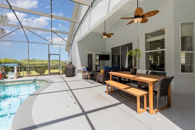 outdoor pool featuring a patio, ceiling fan, outdoor lounge area, and a lanai