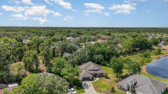 aerial view featuring a water view and a wooded view