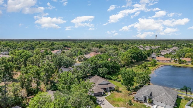 bird's eye view featuring a water view, a view of trees, and a residential view