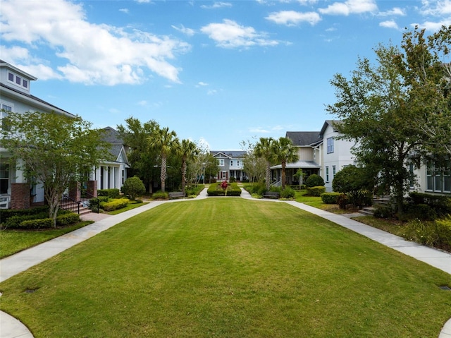 view of home's community with a yard and a residential view
