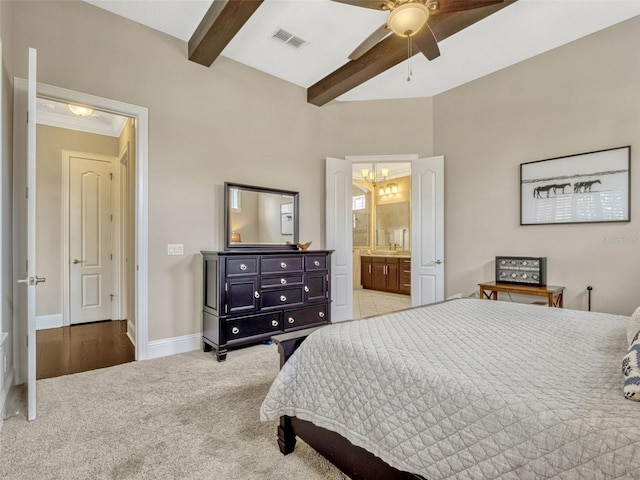 carpeted bedroom with visible vents, beam ceiling, baseboards, connected bathroom, and ceiling fan with notable chandelier