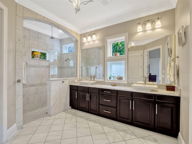 bathroom featuring a sink, a walk in shower, double vanity, and visible vents