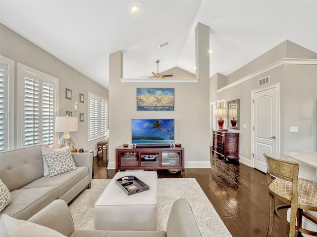 living room featuring a ceiling fan, baseboards, visible vents, and wood finished floors