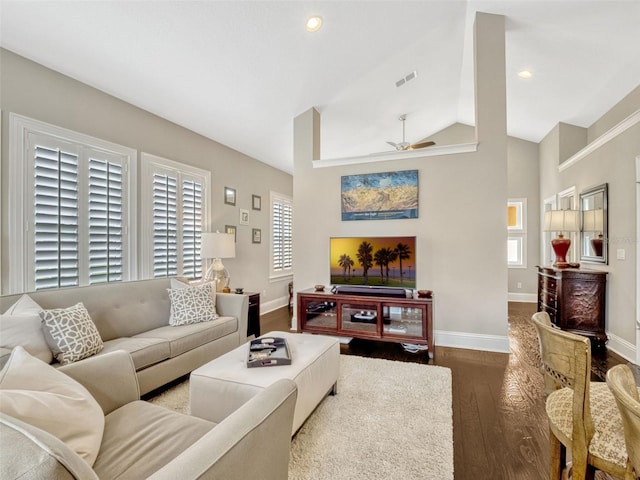 living room featuring a ceiling fan, baseboards, visible vents, and wood finished floors
