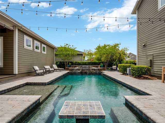 outdoor pool featuring a patio area