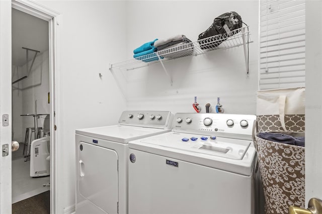 washroom featuring laundry area and independent washer and dryer