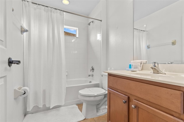 bathroom featuring toilet, tile patterned floors, shower / tub combo, and vanity