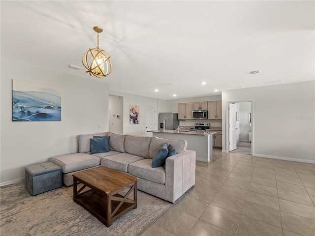living room with light tile patterned floors, baseboards, recessed lighting, and visible vents