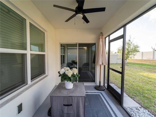 sunroom with a ceiling fan