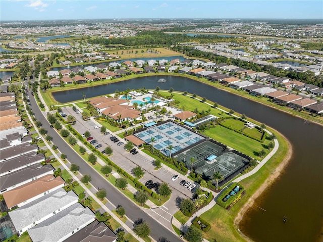 drone / aerial view featuring a water view and a residential view