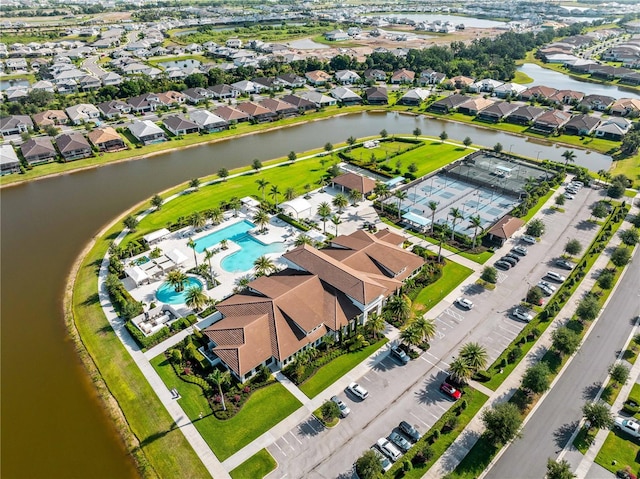 birds eye view of property featuring a water view and a residential view