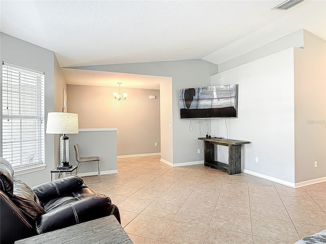 living room with visible vents, a notable chandelier, tile patterned floors, baseboards, and lofted ceiling