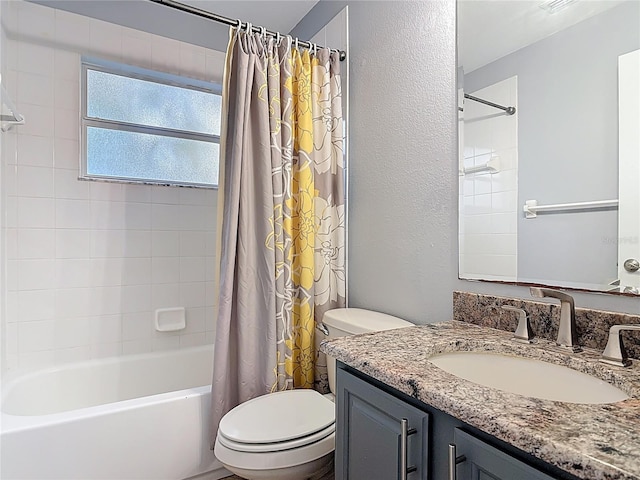 bathroom featuring vanity, a textured wall, toilet, and shower / bathtub combination with curtain